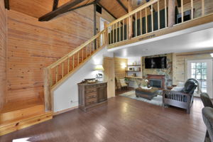 Beautiful stained wood interior and a high vaulted ceiling surrounds you as you enter this home.