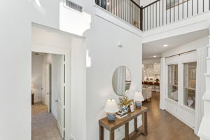 Entryway with walkway to Downstairs Bedroom