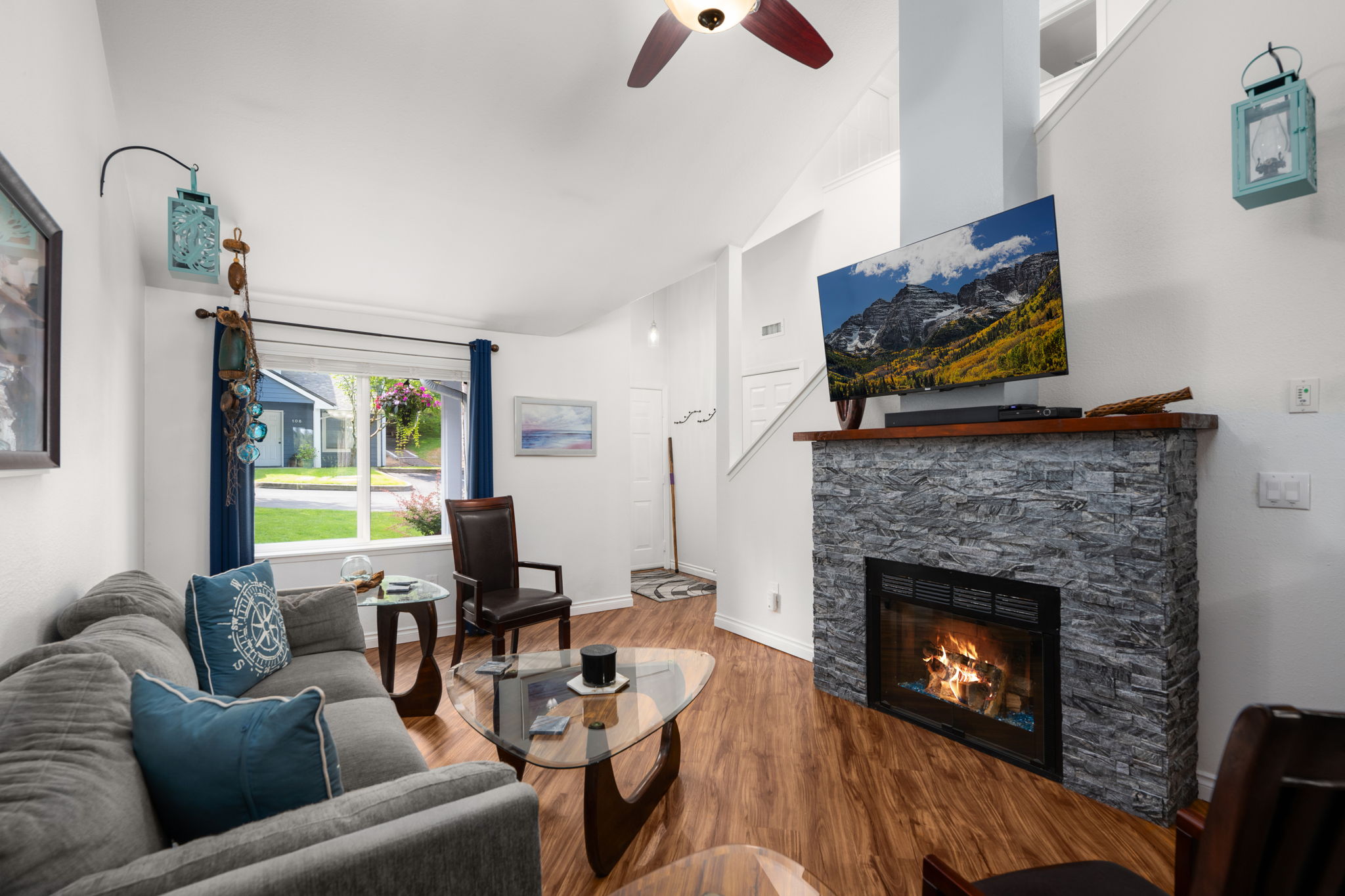 Cozy gas fireplace w/real stone topped w/2" thick wood mantle & blower for added room heating efficiency.