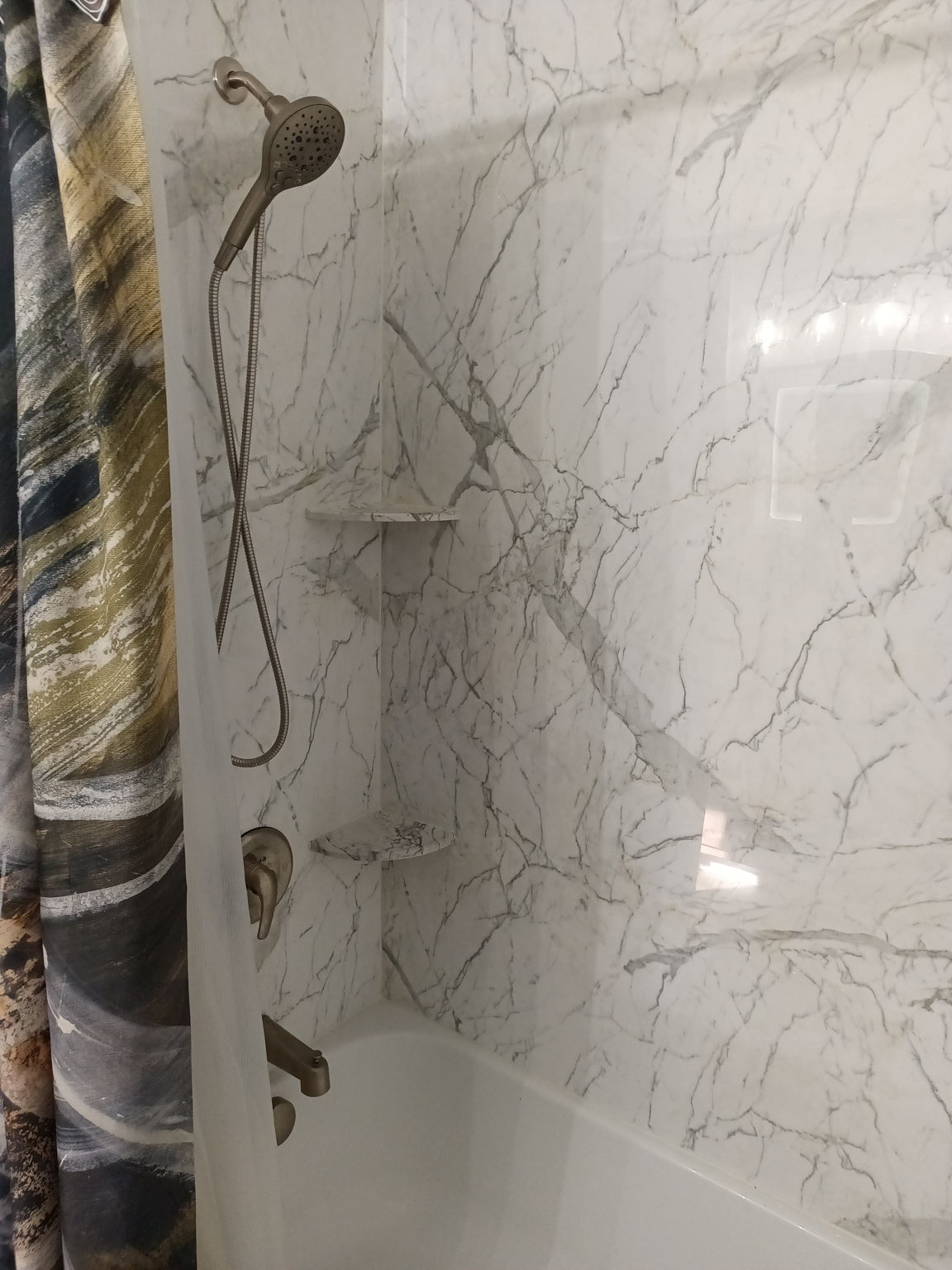 New shower w/marble shelves & SS faucets.