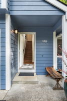 Covered entry leads to open living room.
