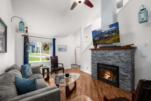 Cozy gas fireplace w/real stone topped w/2" thick wood mantle & blower for added room heating efficiency.