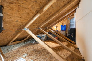 Lighted & floored attic space above 3rd bedroom.