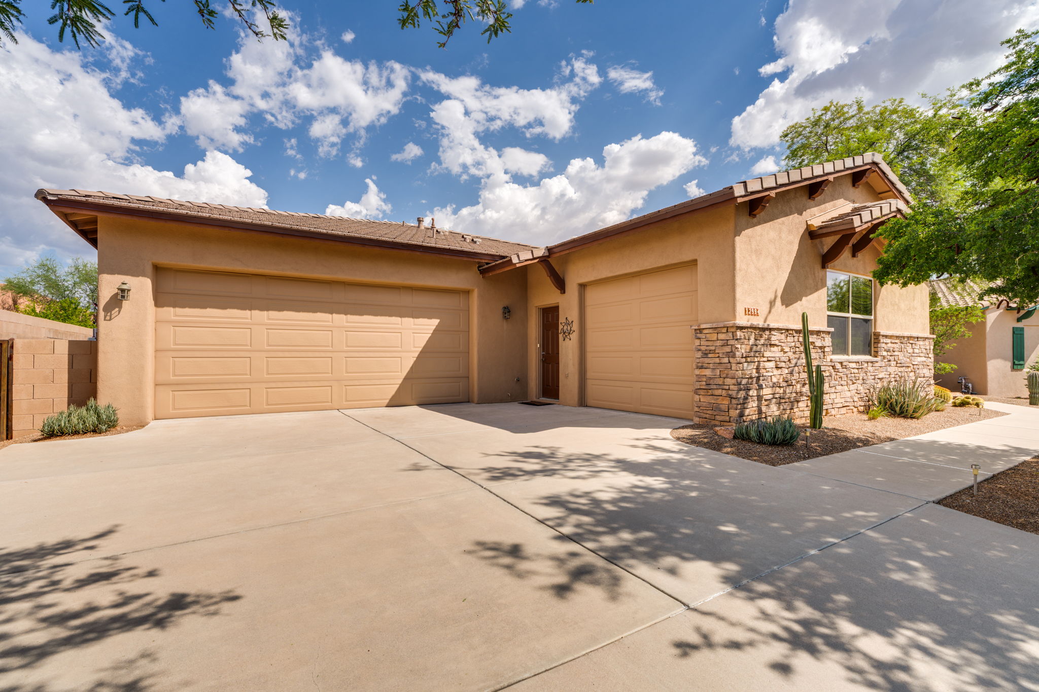 Attached three-car garage (two-car bay and a seperate one-car bay)