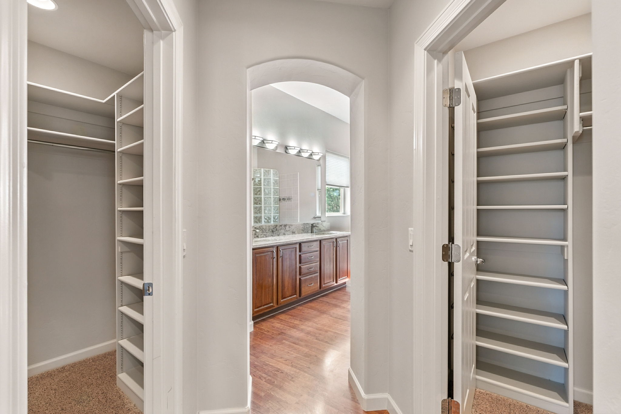 The en suite bath includes dual walk-in closets