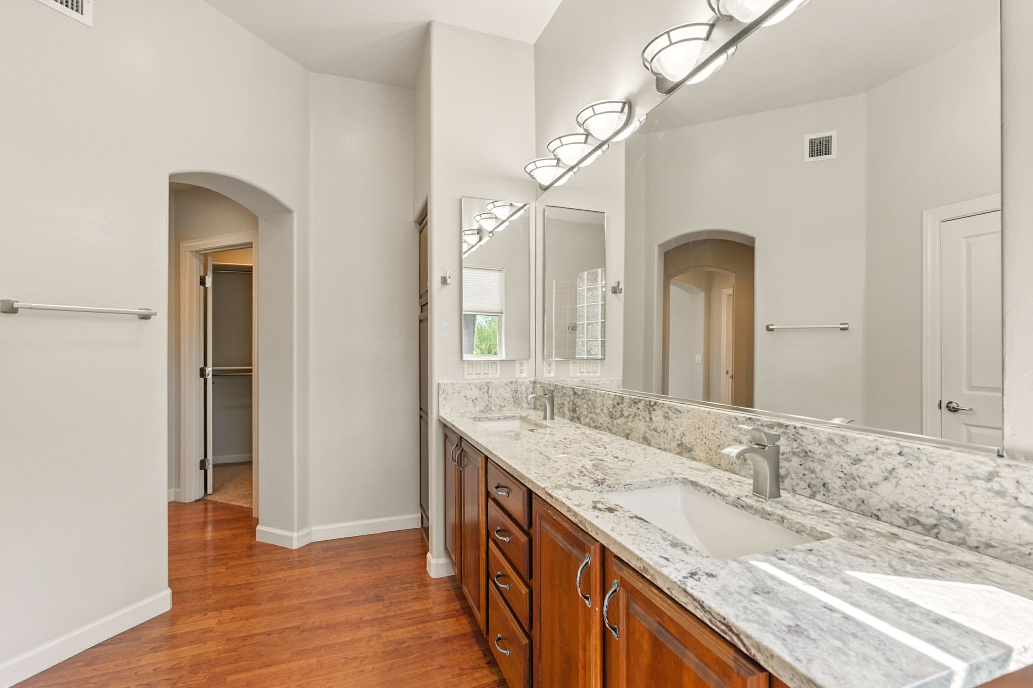 Thoughtfully placed en suite bath ensures privacy and minimizes light distractions