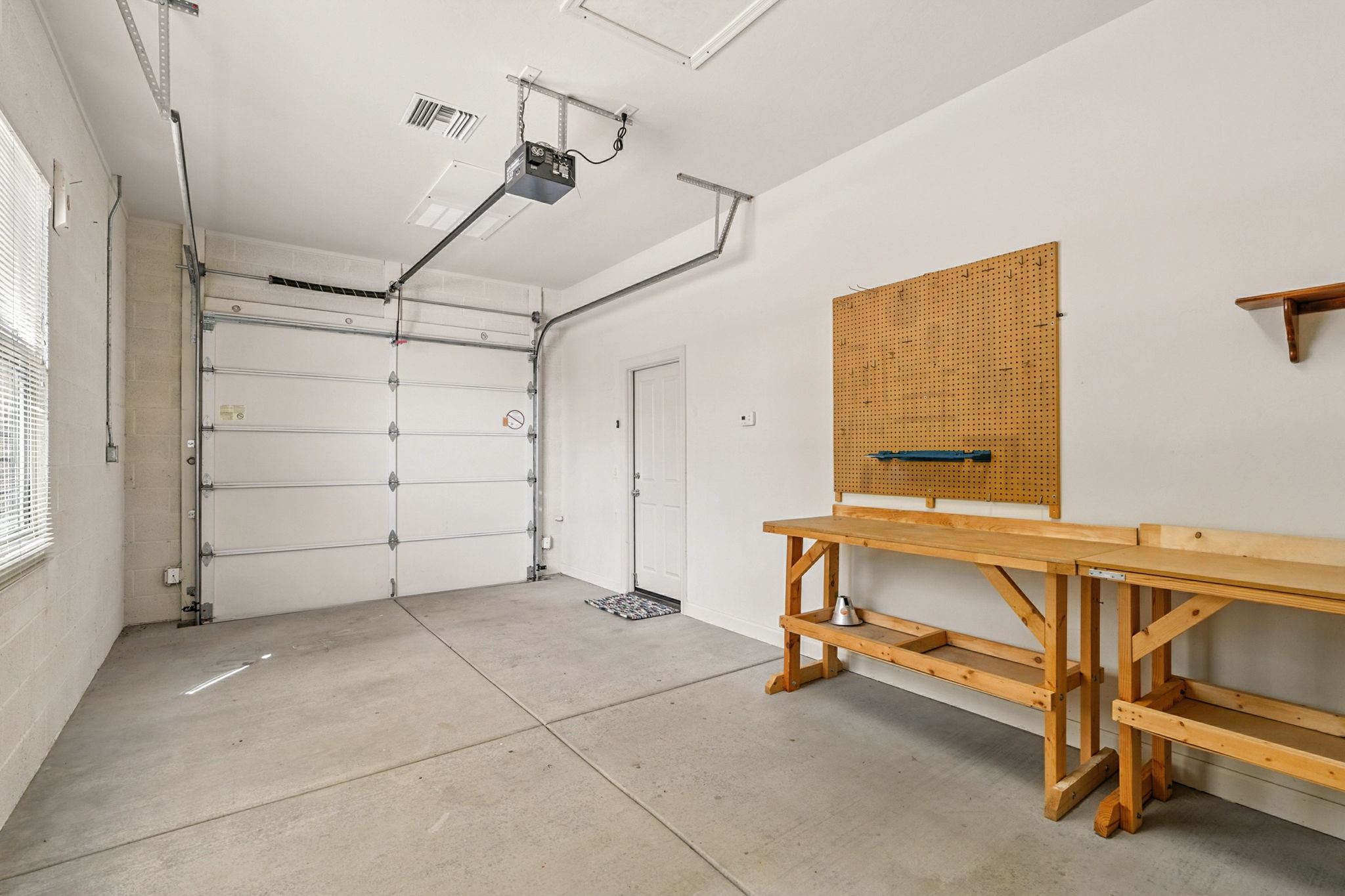 The single-stall garage offers a flexable space that can be transformed into a workshop, studio, gym, or office to fit your lifestyle