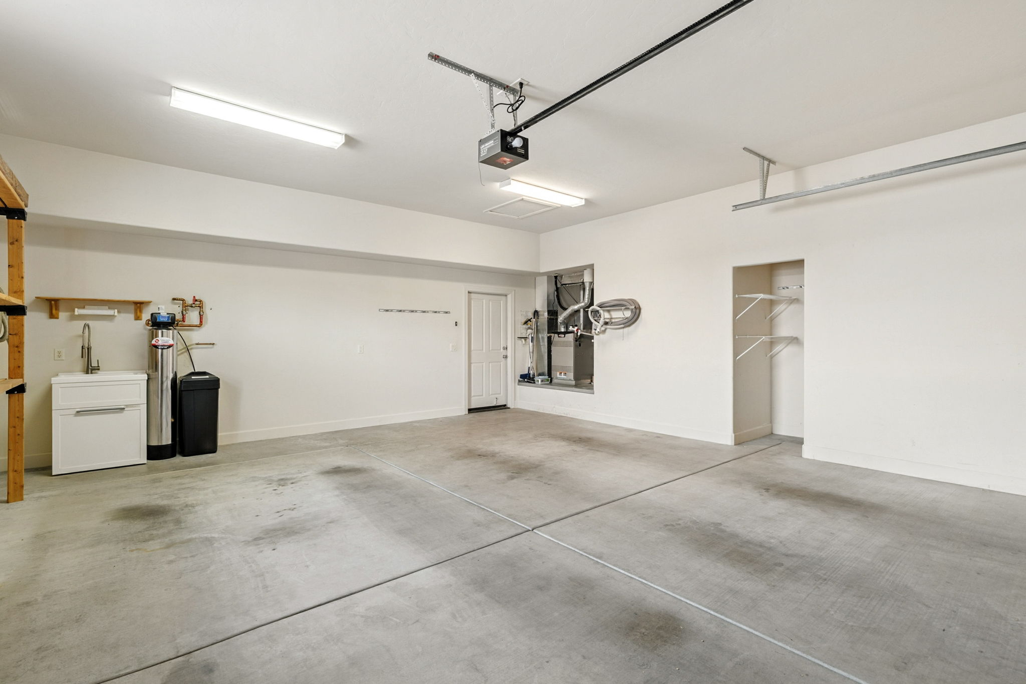 The attached two-car garage connects directly to the kitchen for convenience