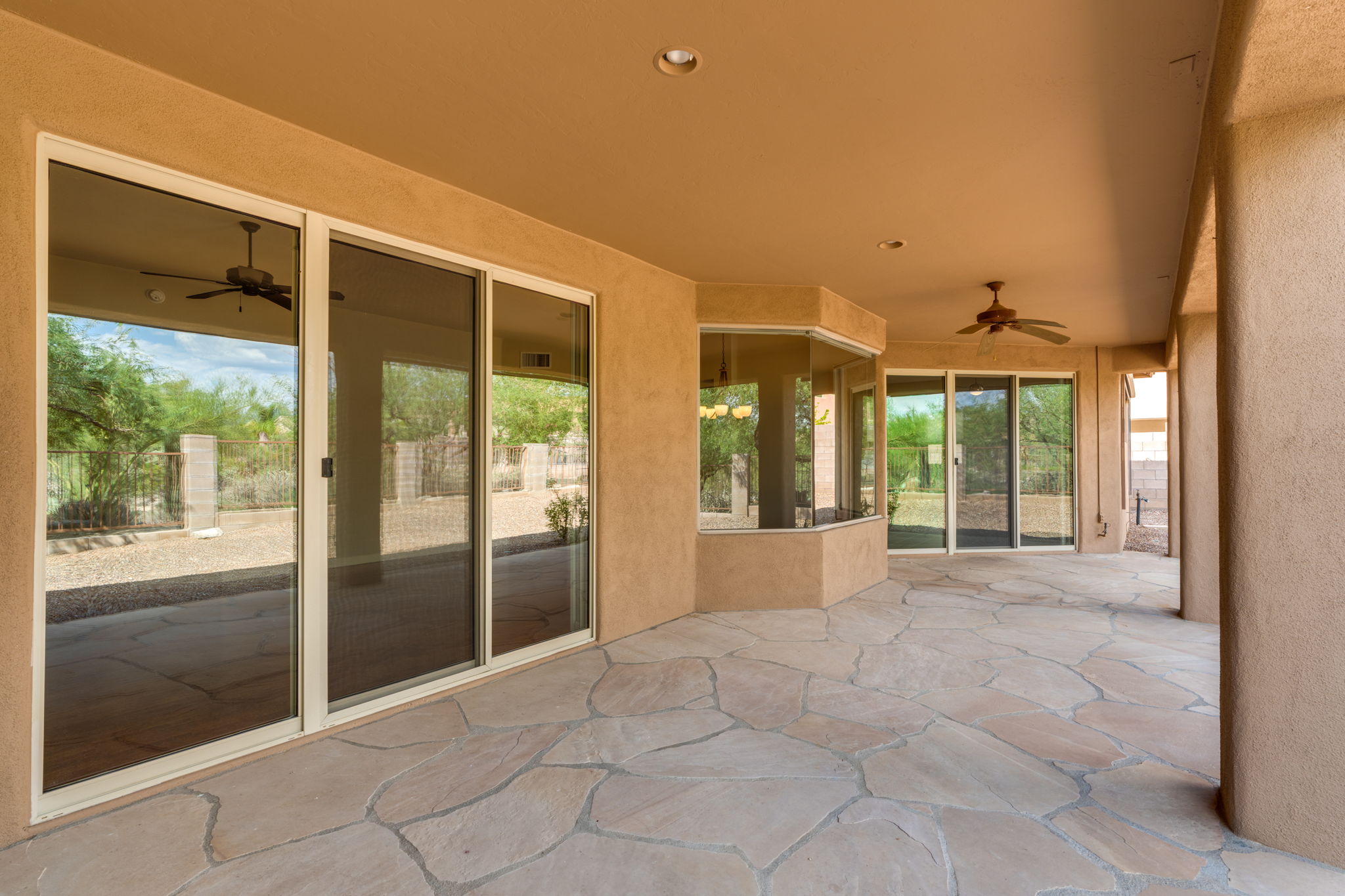 Expansive covered patio provides ample space for seating and outdoor dining