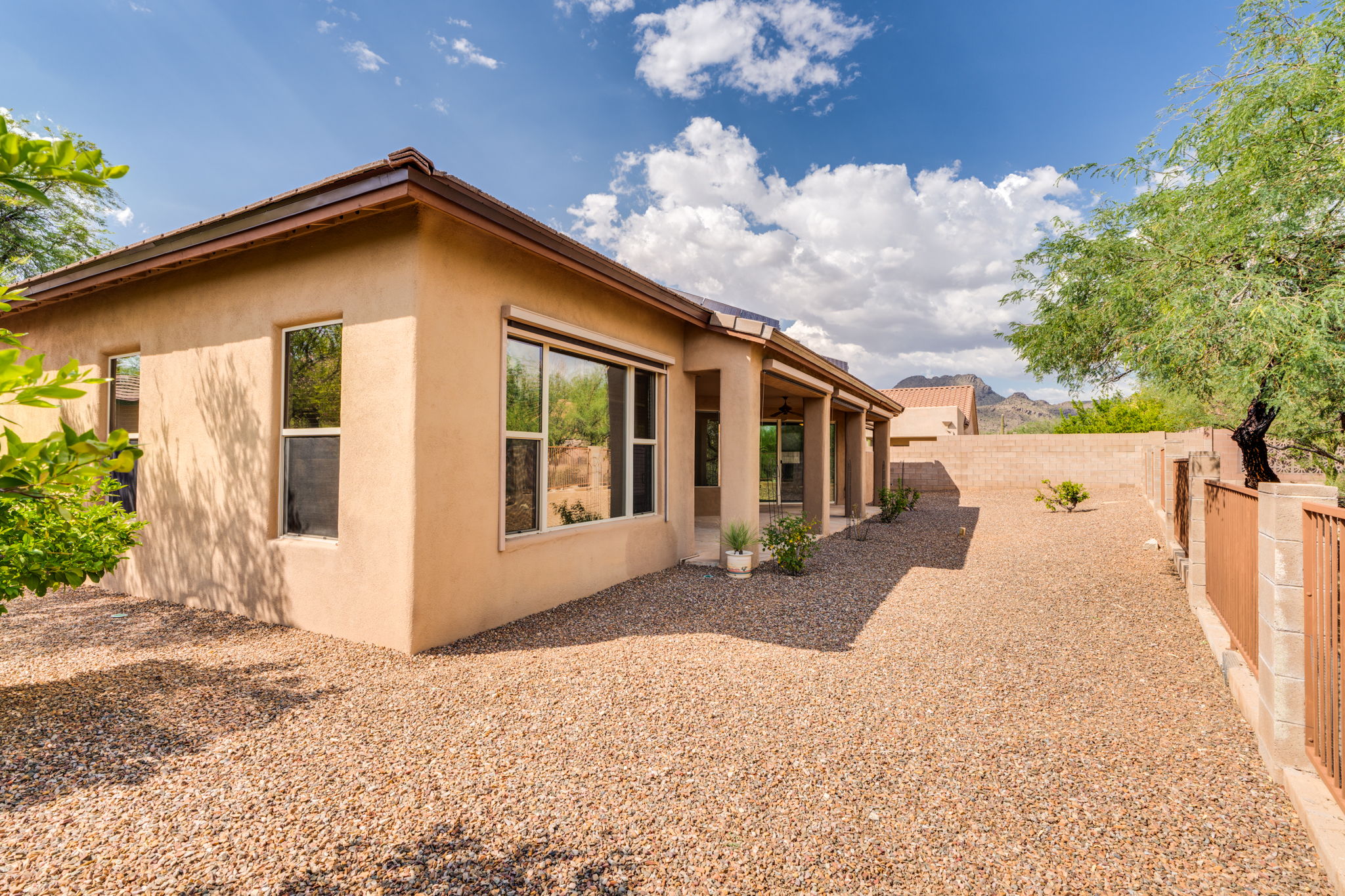The backyard is framed by beautiful mountain views off to the side