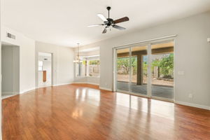 The living room's glass slider offers direct access to the covered rear patio