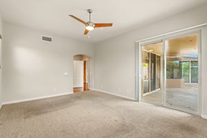 The owner's suite has direct access to the covered rear patio, making it easy to step outside and enjoy the peaceful desert mornings