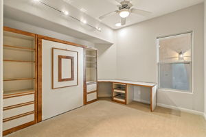 Bedroom two offers flexibility with a built-in desk and Murphy bed with storage, ideal for guests, a home office, or a creative studio