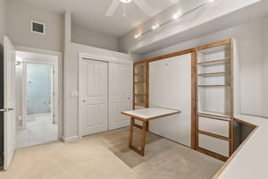 The murphy bed features a pull down table providing additional worksapce