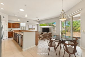 The open-kitchen offers a casual dining area and ample space for leisure