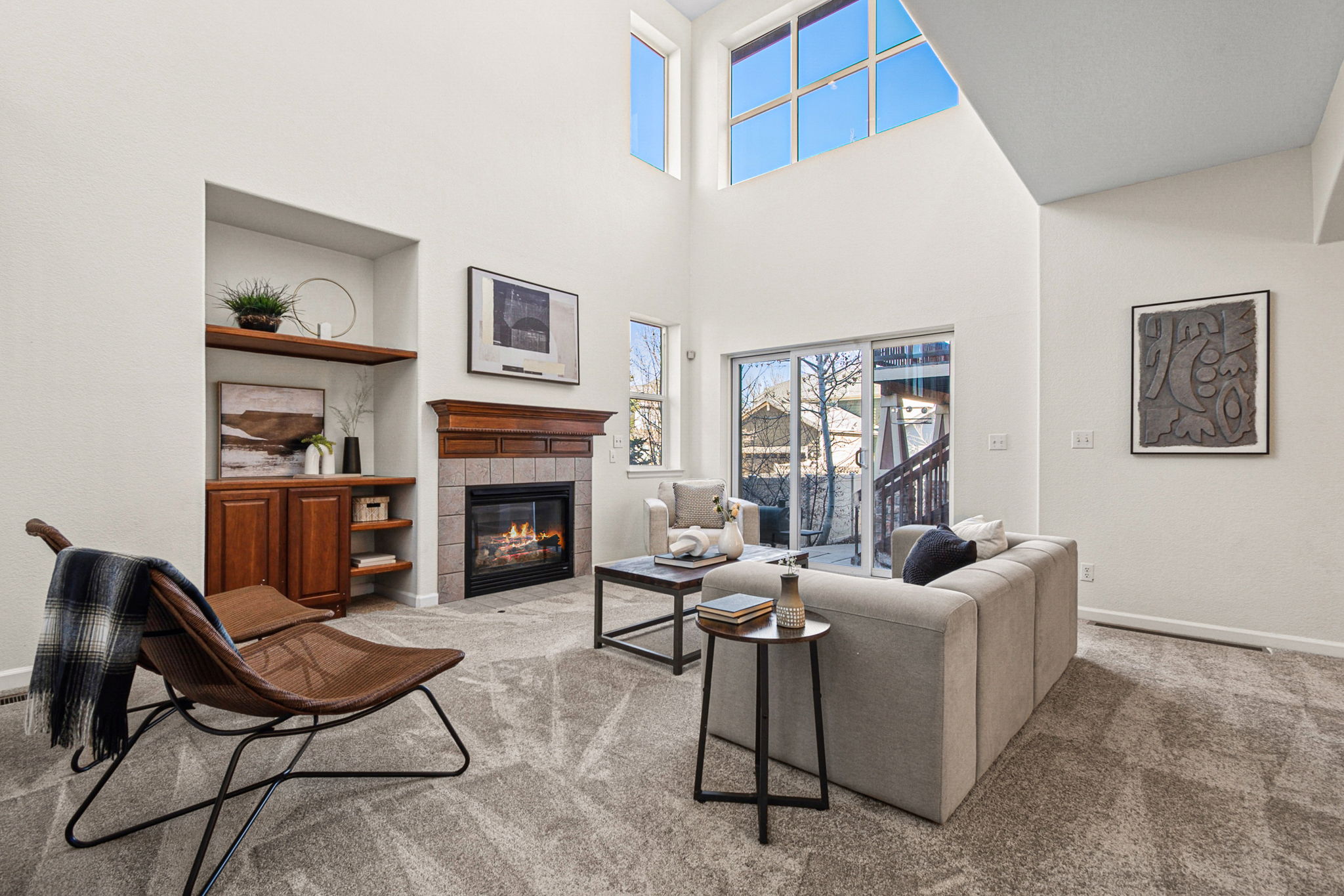 Light, bright living room with a cozy fireplace