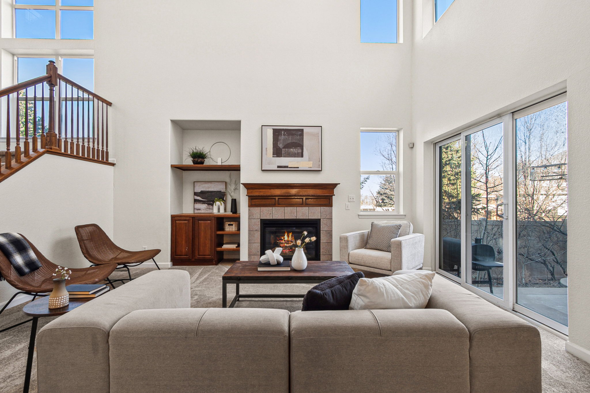 Light, bright living room with a cozy fireplace