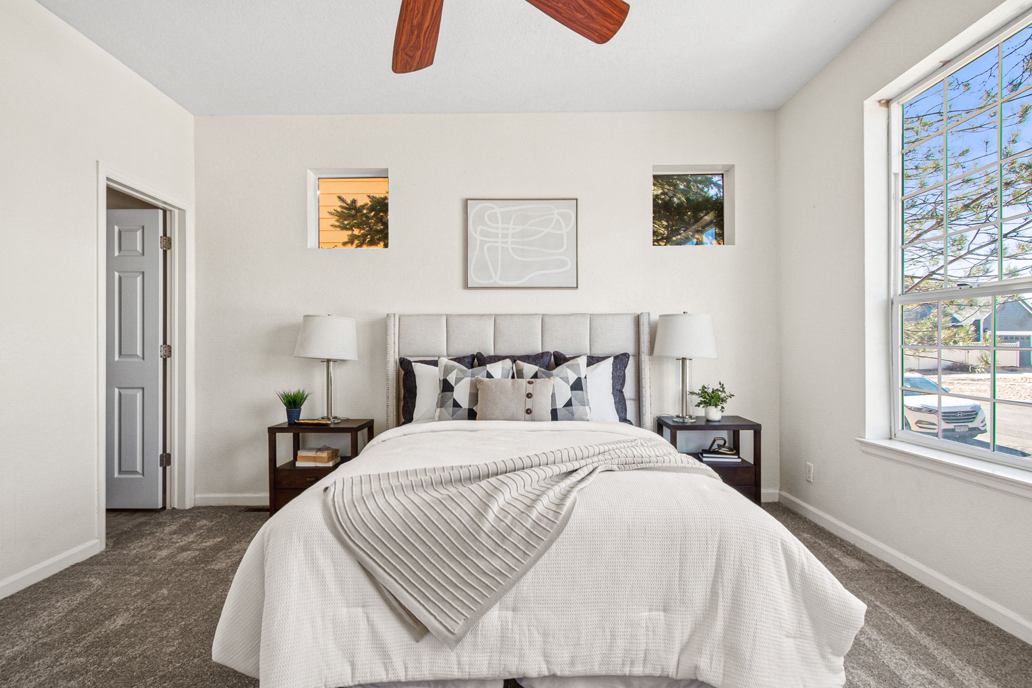 Light-filled main floor primary bedroom