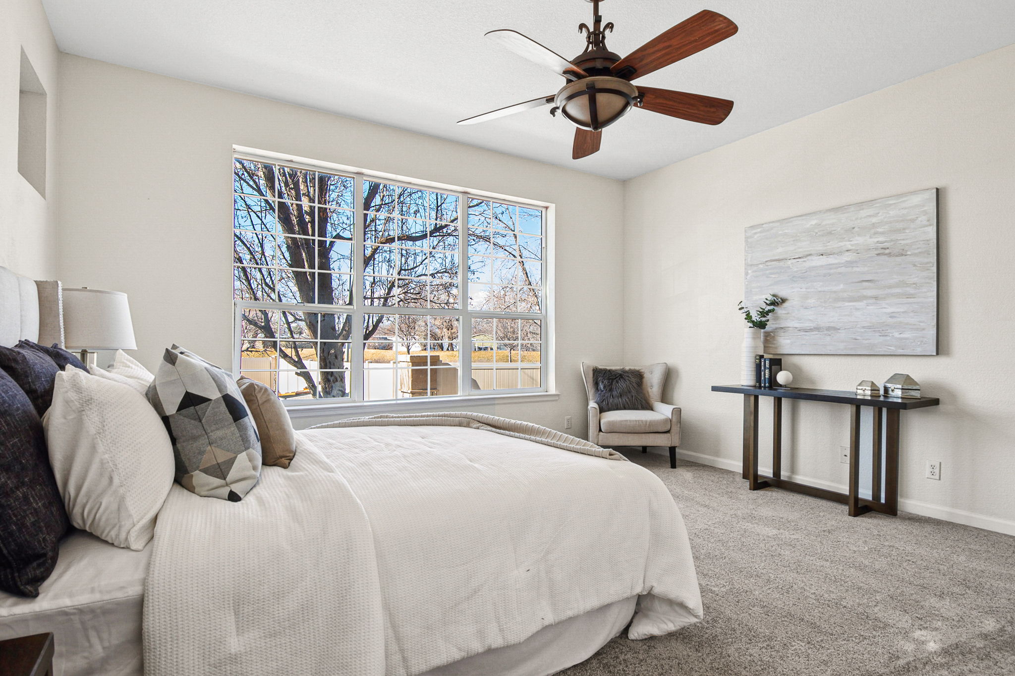 Light-filled main floor primary bedroom