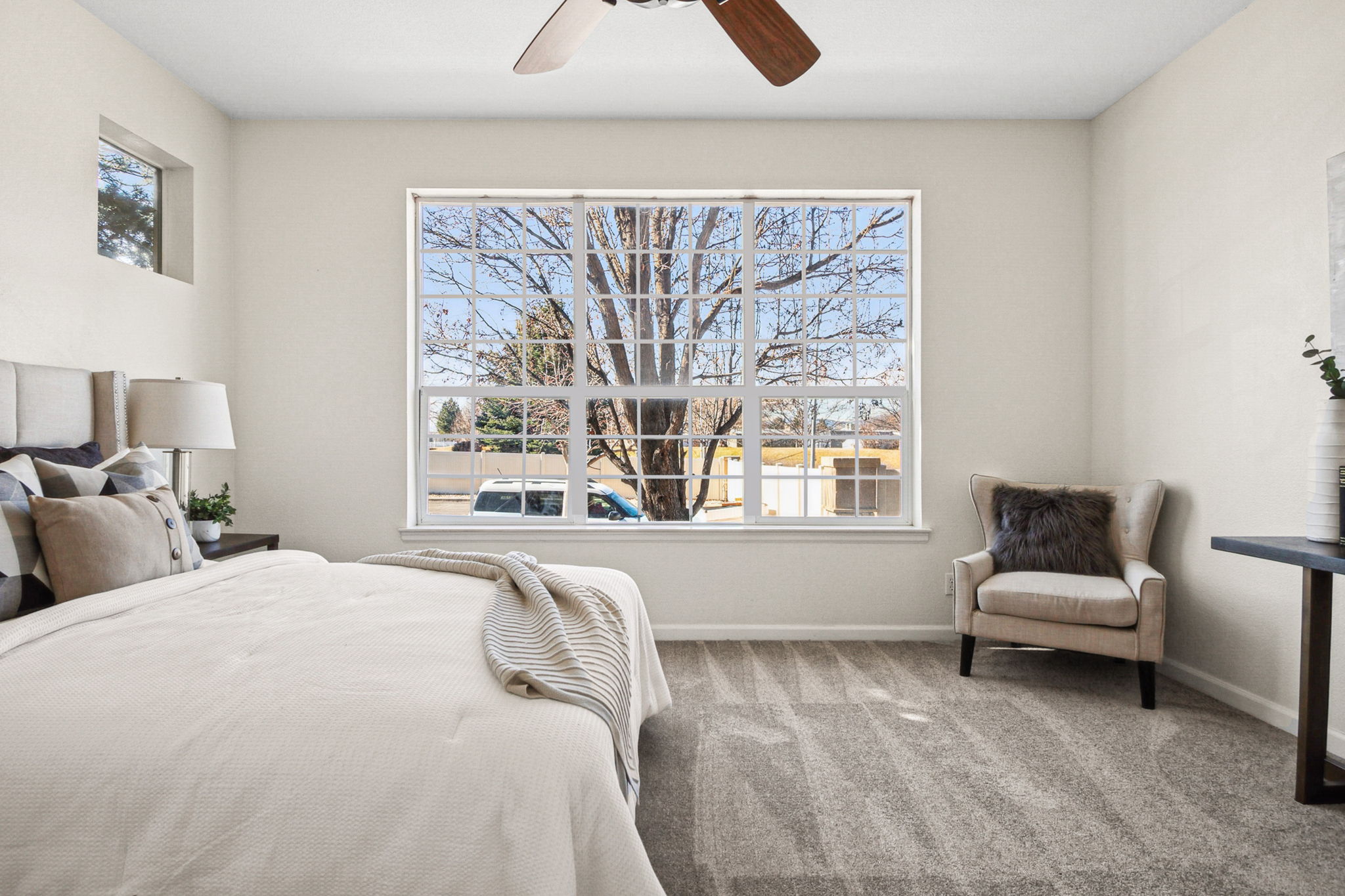 Light-filled main floor primary bedroom