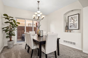 Spacious formal dining room adjacent to outdoor entertaining space