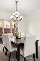 Spacious formal dining room adjacent to outdoor entertaining space