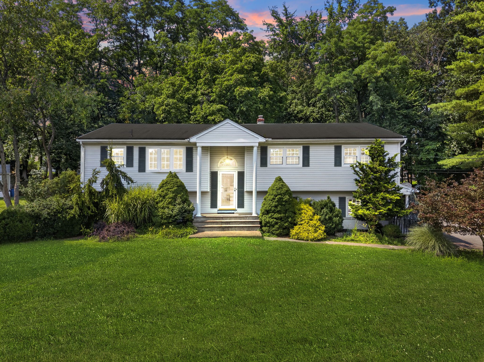 Set on a larger-than-typical property of nearly 3/4 acre, this 5-bedroom, 4-bath bi-level offers 2,796 sq ft of living space. Great curb appeal, a large driveway, and a side-entry garage create a memorable first impression as you arrive along the sidewalk-lined, tree-lined street.