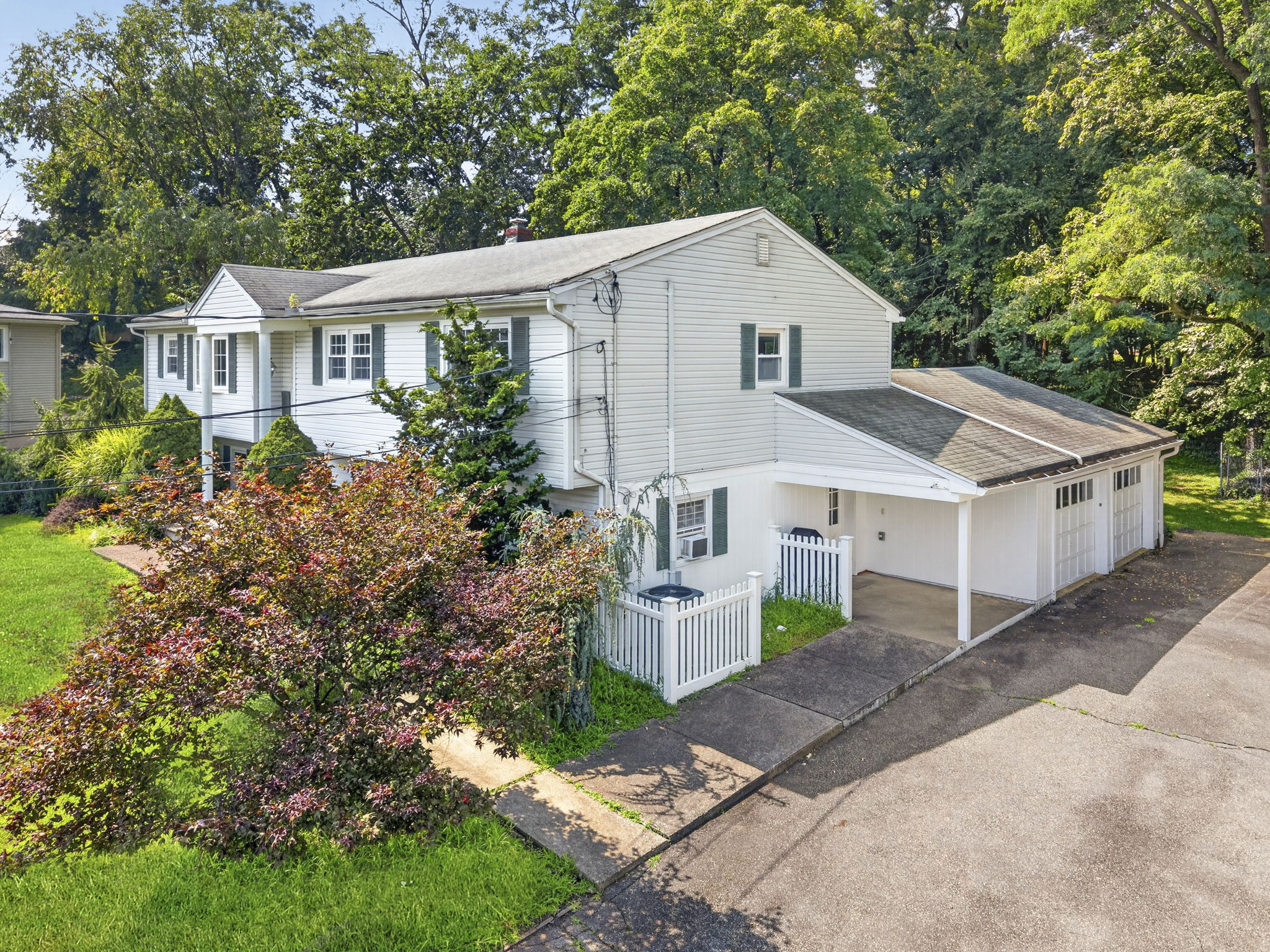 Set on a larger-than-typical property of nearly 3/4 acre, this 5-bedroom, 4-bath bi-level offers 2,796 sq ft of living space. Great curb appeal, a large driveway, and a side-entry garage create a memorable first impression as you arrive along the sidewalk-lined, tree-lined street.