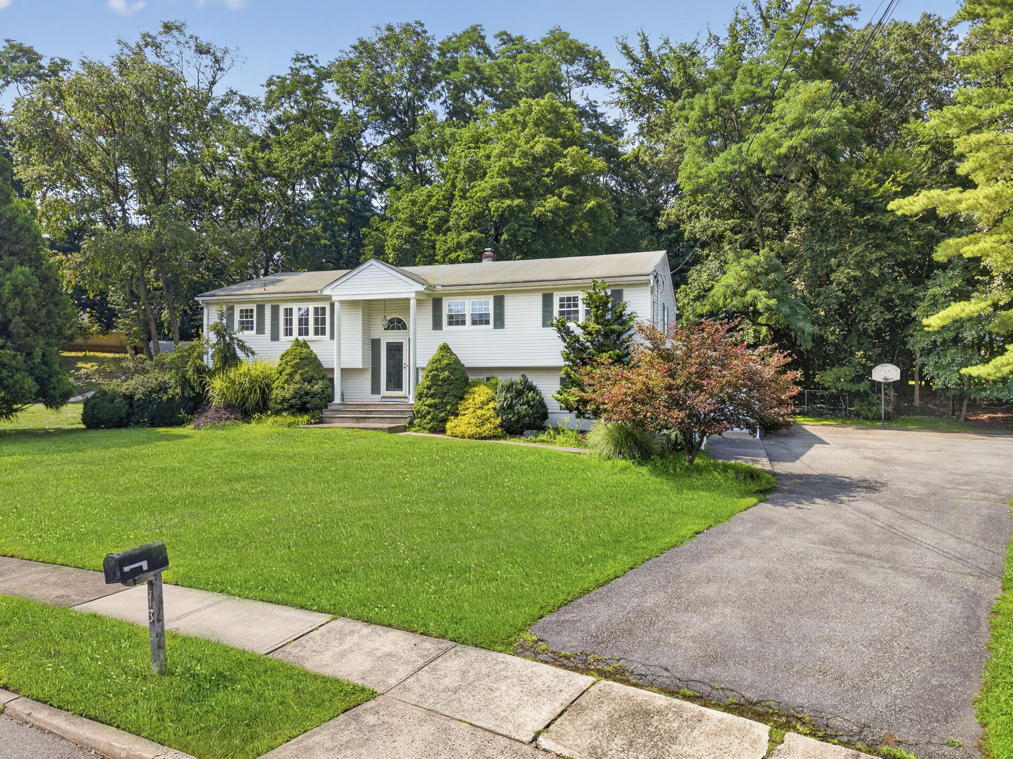 Set on a larger-than-typical property of nearly 3/4 acre, this 5-bedroom, 4-bath bi-level offers 2,796 sq ft of living space. Great curb appeal, a large driveway, and a side-entry garage create a memorable first impression as you arrive along the sidewalk-lined, tree-lined street.