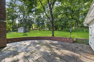A large stone patio overlooks the expansive backyard, providing plenty of room to dine, relax, garden, or entertain throughout the seasons. With nearly 3/4 acre, this property offers the outdoor space so many buyers are searching for.