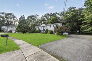Set on a larger-than-typical property of nearly 3/4 acre, this 5-bedroom, 4-bath bi-level offers 2,796 sq ft of living space. Great curb appeal, a large driveway, and a side-entry garage create a memorable first impression as you arrive along the sidewalk-lined, tree-lined street.