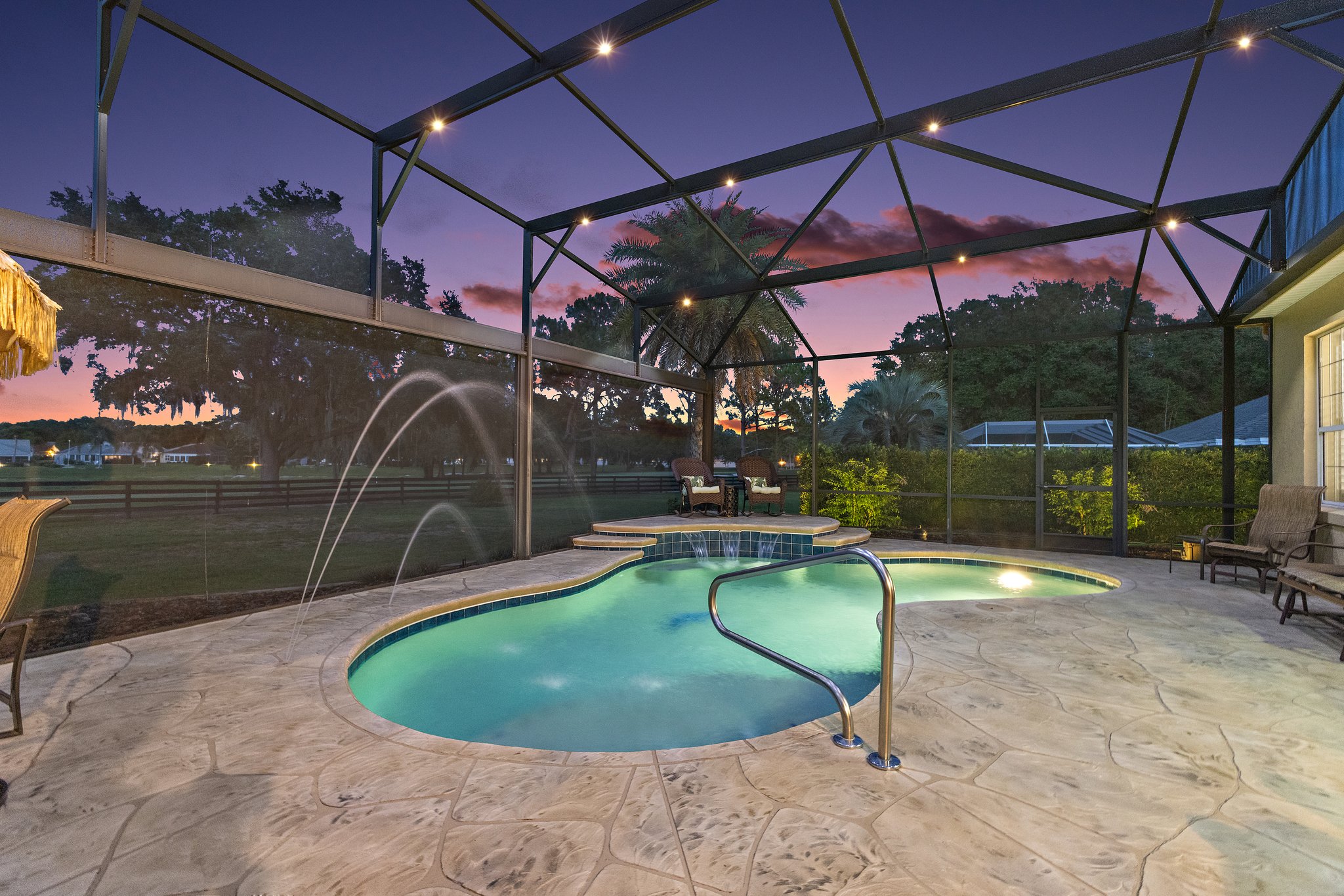 Twilight Swimming Pool with Waterfall and Fountain