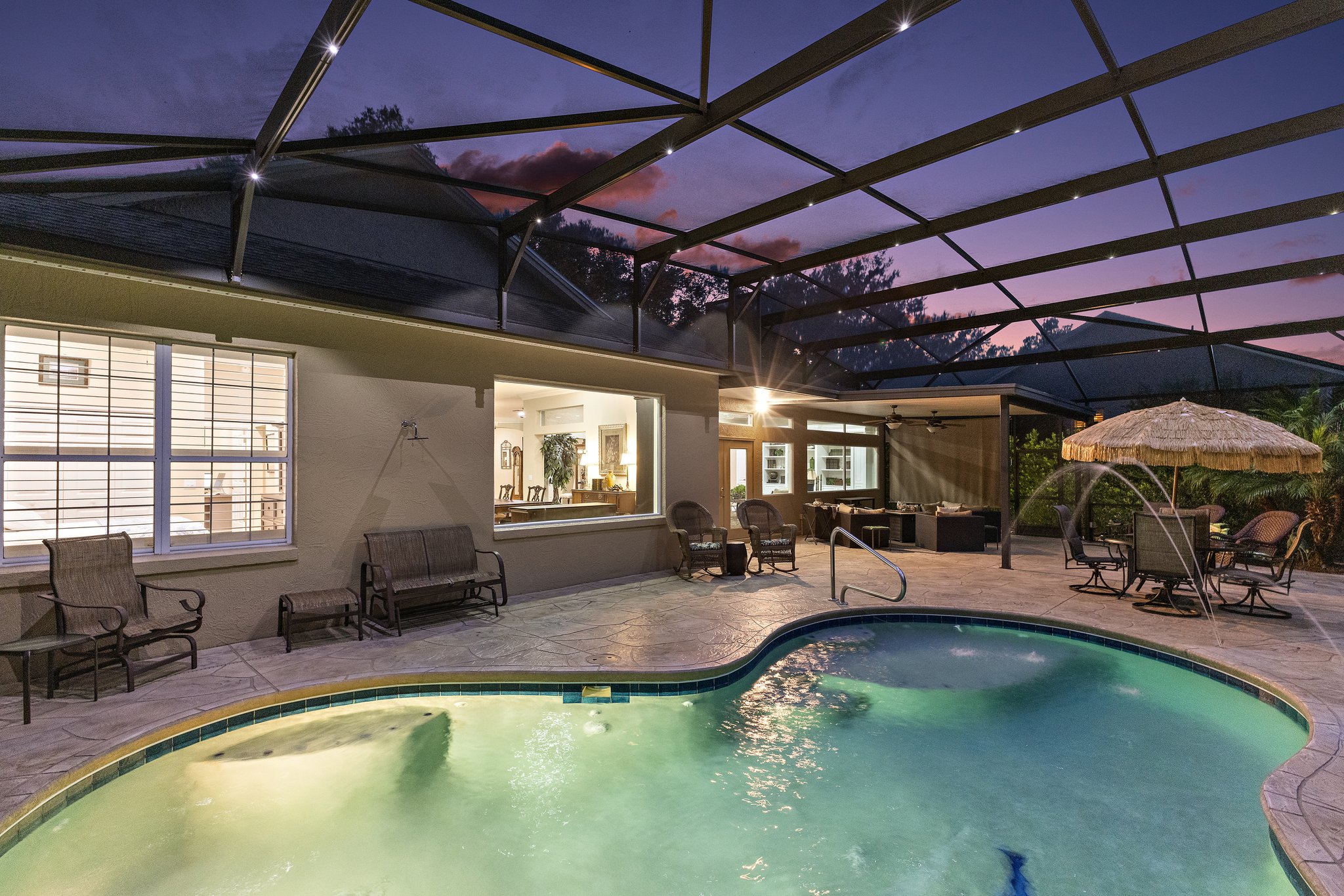 Twilight Swimming Pool with Waterfall and Fountain
