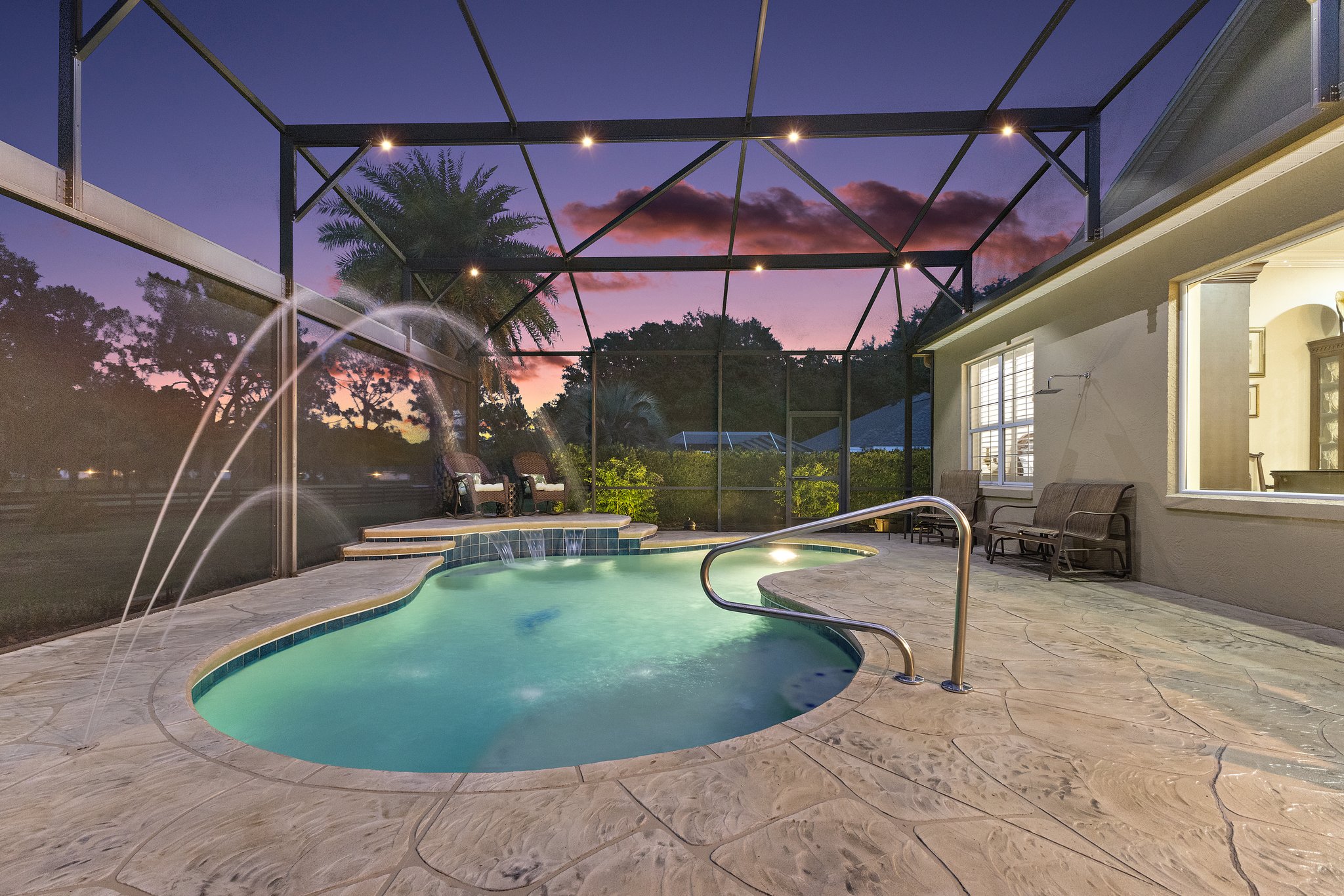 Twilight Swimming Pool with Waterfall and Fountain