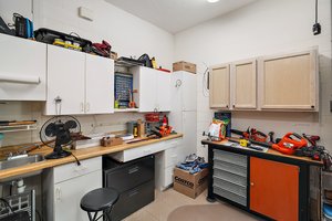 Workbench, Cabinetry, and Utility Sink in Oversized Garage