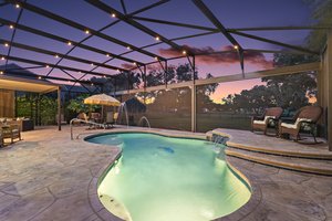 Twilight Swimming Pool with Waterfall and Fountain