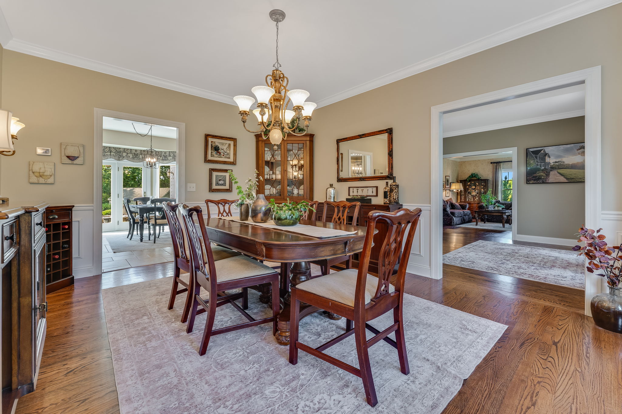 FORMAL DINING ROOM Crown and Chair Rail Moulding, Box Trim, Bronze and Frosted Glass Light Fixture, Sconces, Bay Window, Hardwood Flooring