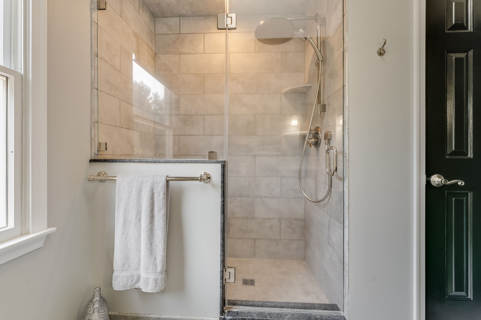 HALL BATH Shower in Tile Surround with Product Shelves and Bench