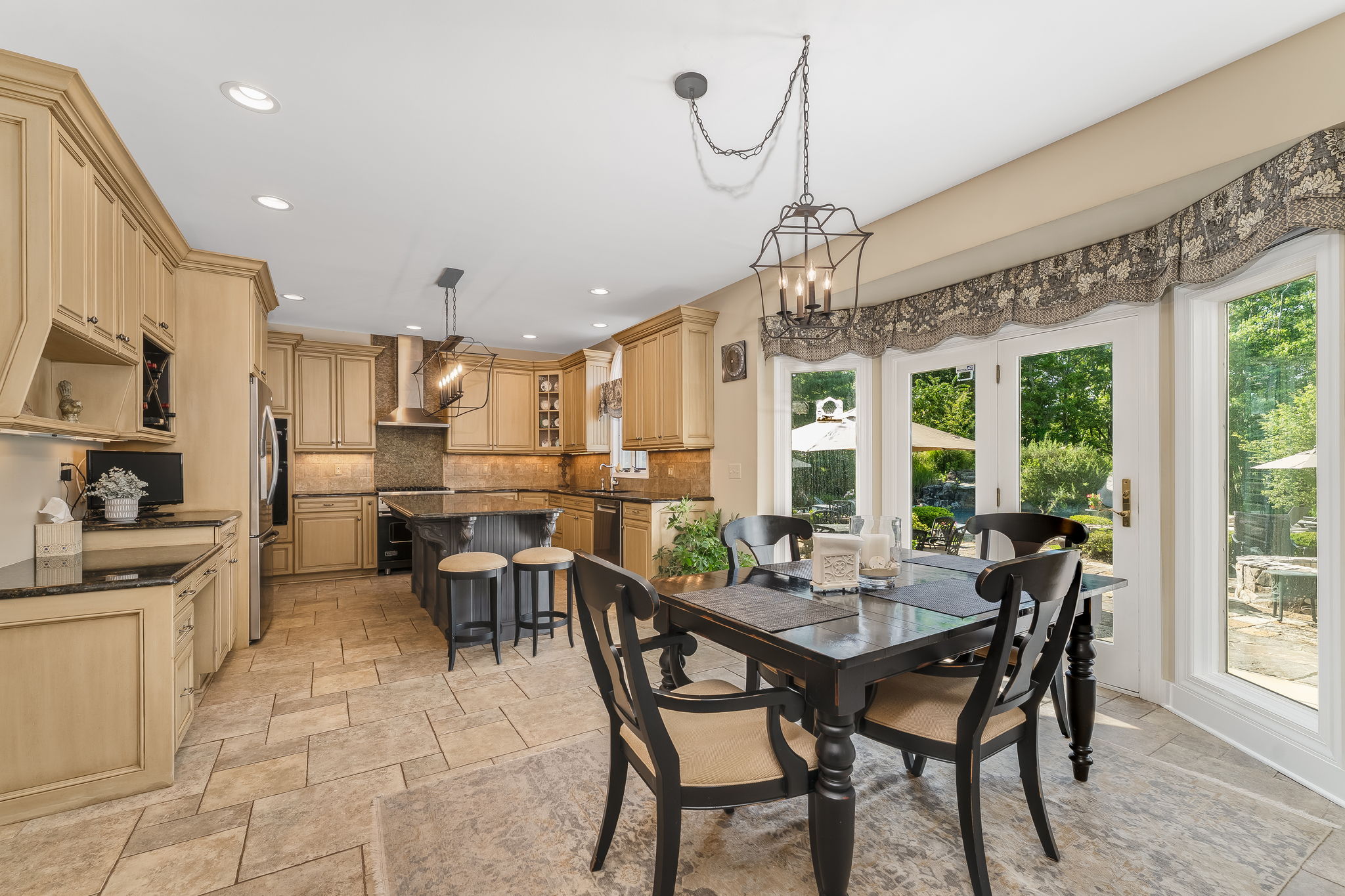 GOURMET KITCHEN Raised Panel Cabinetry, 42 inch Upper Cab, Desk, Wine Cubbies, Spice Racks, Recessed Lighting, Cage Light Fixtures, Under Cab Lighting, Above Cab Lighting
