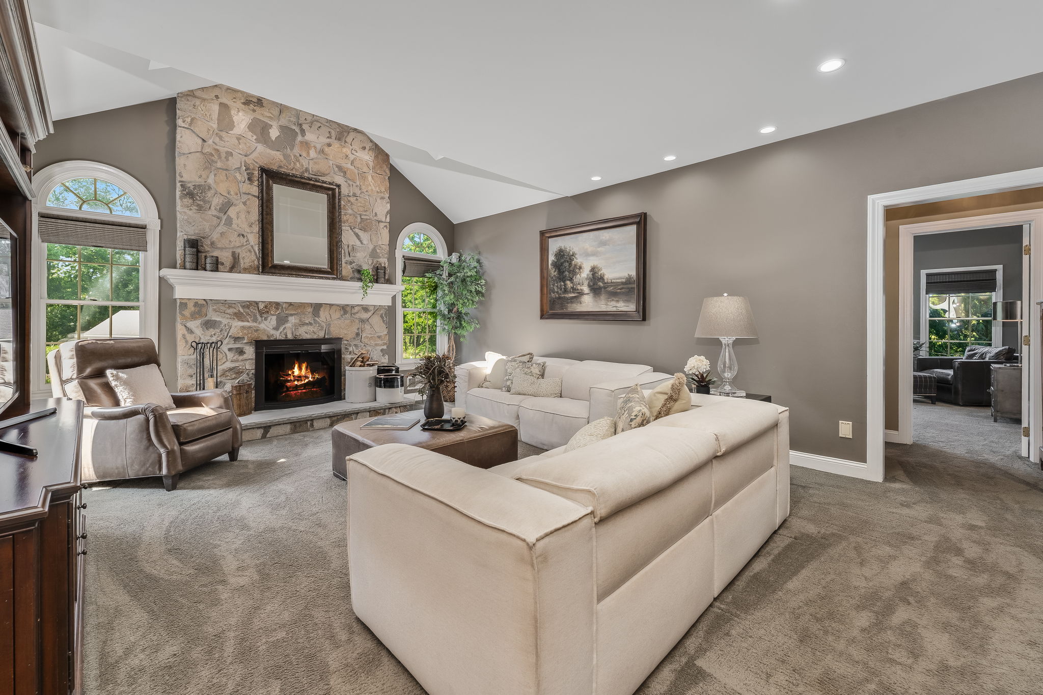 FAMILY ROOM The open flow between the kitchen and living areas creates a warm, inviting atmosphere where everyone naturally gathers.