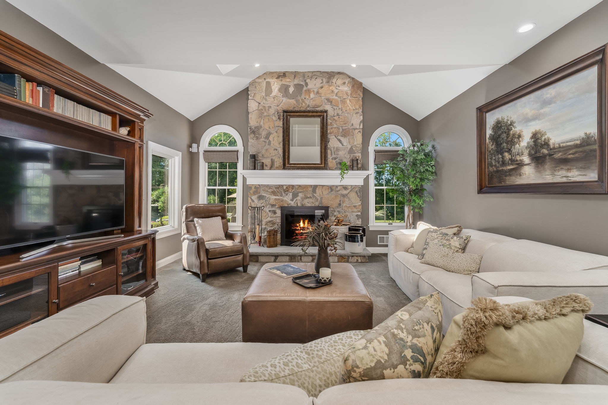 FAMILY ROOM The open flow between the kitchen and living areas creates a warm, inviting atmosphere where everyone naturally gathers.