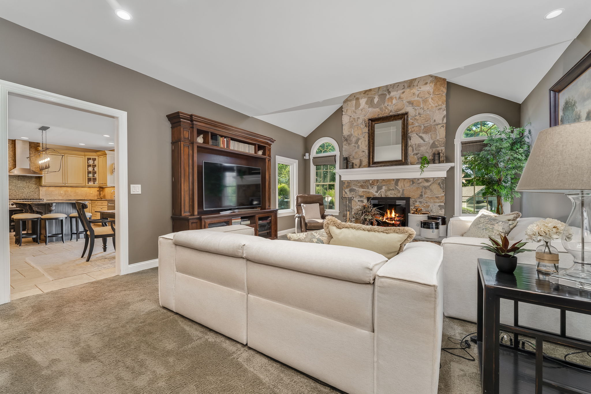 FAMILY ROOM The open flow between the kitchen and living areas creates a warm, inviting atmosphere where everyone naturally gathers.
