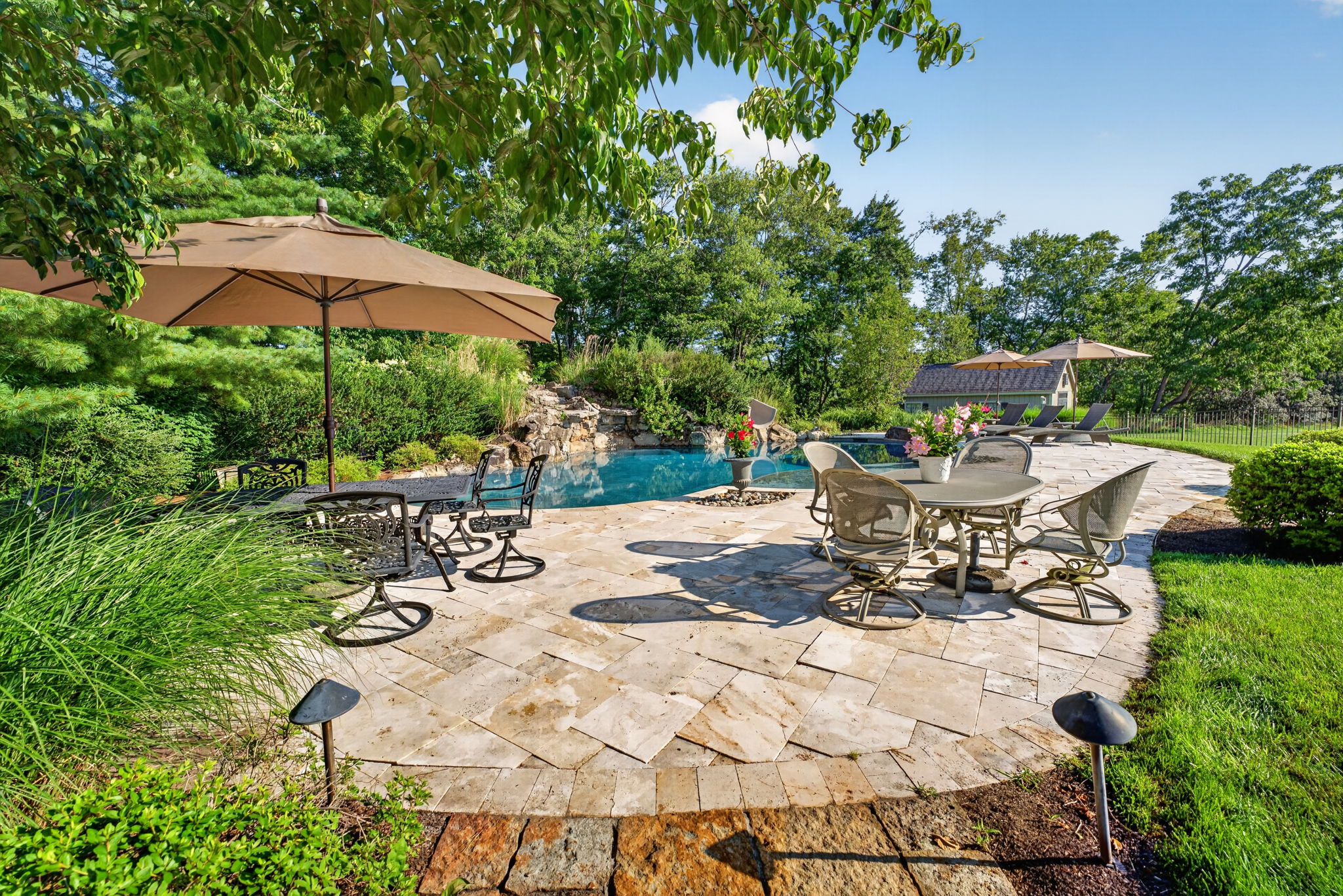 SALTWATER POOL Custom Heated Saltwater Pool with Travertine Coping And Patio Surround/Natural Stone Waterfall/Custom Slide/Pennsylvania Moss Rock Diving Stone. Polaris Aqua Plus Robotic Pool Cleaner (included).