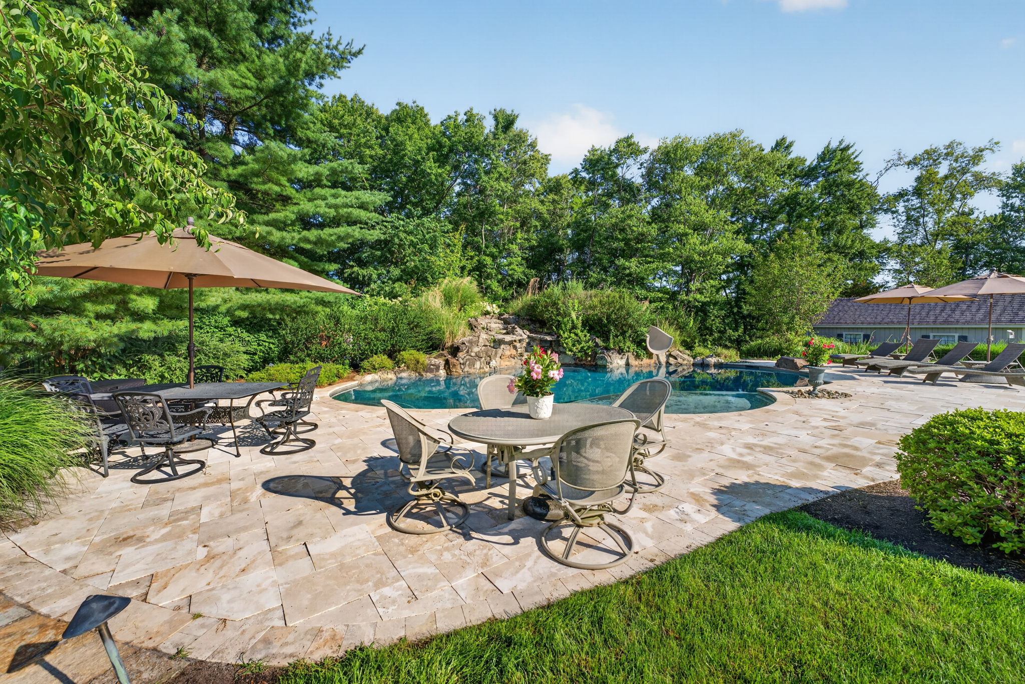 SALTWATER POOL Custom Heated Saltwater Pool with Travertine Coping And Patio Surround/Natural Stone Waterfall/Custom Slide/Pennsylvania Moss Rock Diving Stone. Polaris Aqua Plus Robotic Pool Cleaner (included).