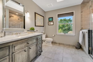 HALL BATH Remodeled 2016 - Skylight, Furniture Grade Vanity with Marble Top and Undermount Porcelain Sink, Programmable Heated Tile Floor