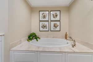 PRIMARY BATH Kohler Soaking Tub with Heated Backrest,Programmable Heated Travertine Tile Floor