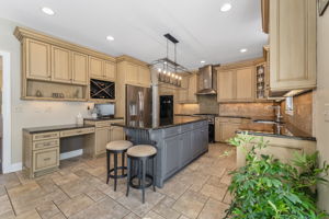GOURMET KITCHEN Raised Panel Cabinetry, 42 inch Upper Cab, Desk, Wine Cubbies, Spice Racks, Recessed Lighting, Cage Light Fixtures, Under Cab Lighting, Above Cab Lighting