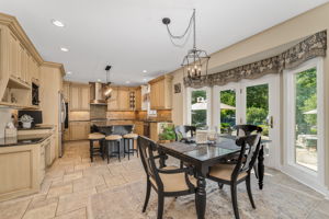 GOURMET KITCHEN Gourmet chef's kitchen features premium finishes, high-end appliances, and abundant prep space. Center Island with Breakfast Seating and Granite Countertop