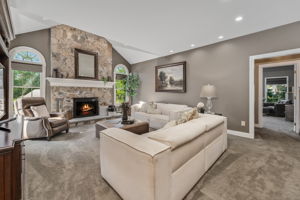 FAMILY ROOM The open flow between the kitchen and living areas creates a warm, inviting atmosphere where everyone naturally gathers.