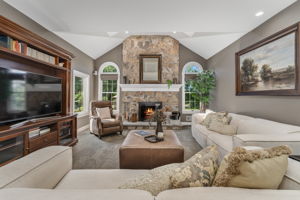 FAMILY ROOM The open flow between the kitchen and living areas creates a warm, inviting atmosphere where everyone naturally gathers.